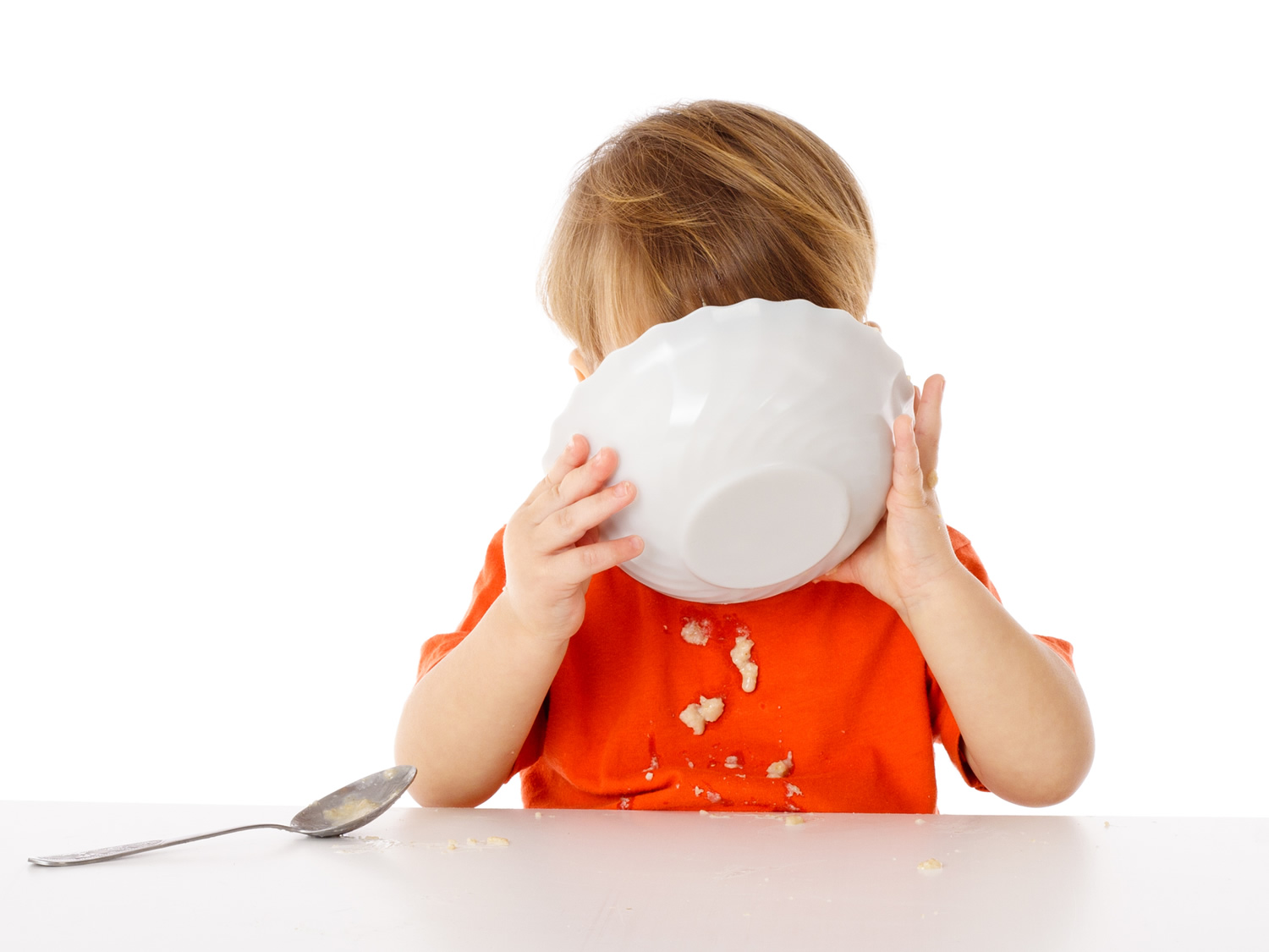 child eating dried cereal - image